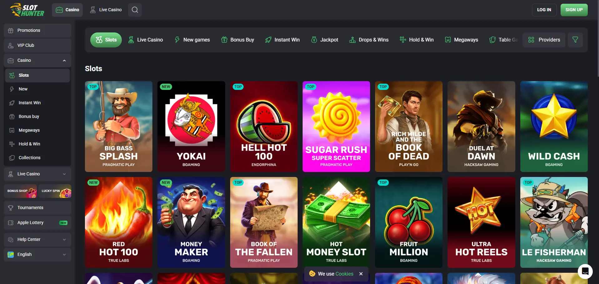 SlotHunter Casino desktop games page showing slot categories, provider filters and a game grid with titles including Big Bass Splash, Yokai, Hell Hot 100 and Sugar Rush Super Scatter.