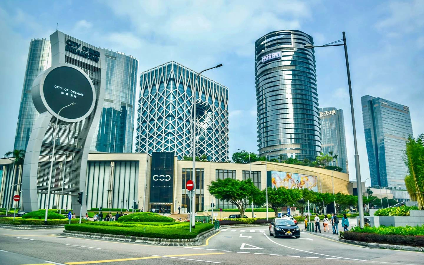 City of Dreams Macau exterior in Cotai, showing the casino resort towers and main entrance from the street.