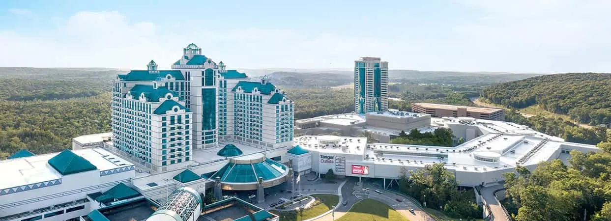 Foxwoods Resort Casino aerial view in Mashantucket, Connecticut, showing the hotel towers, casino complex, and surrounding forest.
