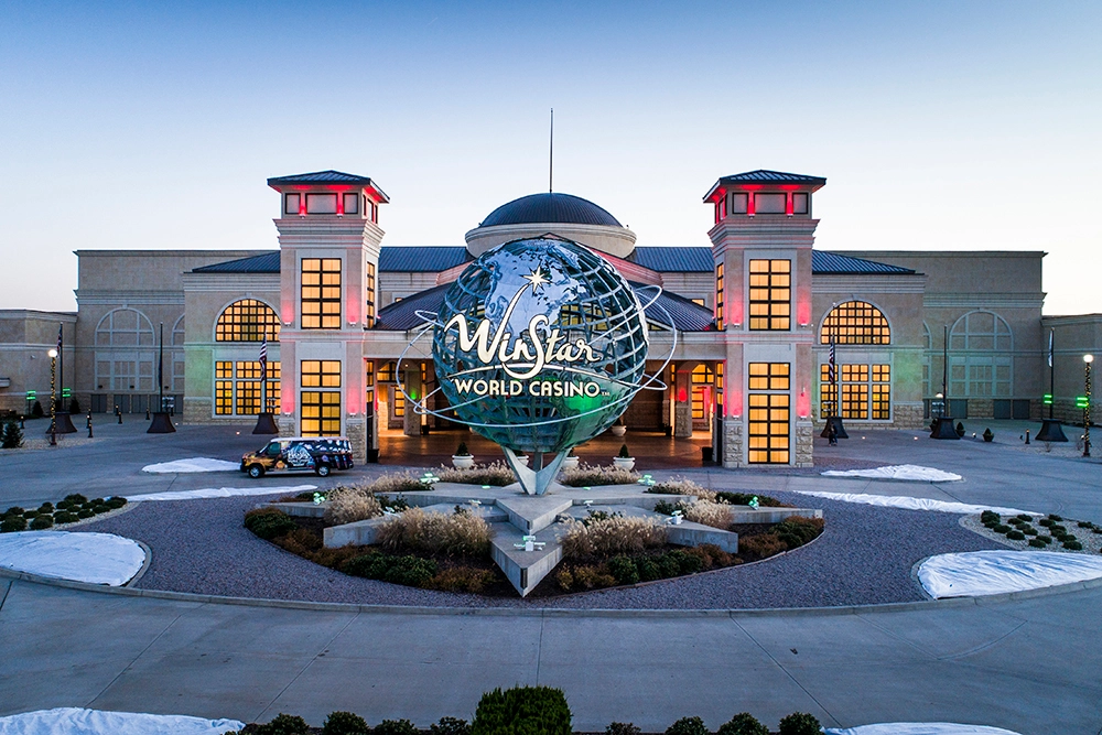 WinStar World Casino exterior in Thackerville, Oklahoma, with the globe entrance sign in front of the main building.